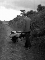 Collector Leo Corduff transporting heavy recording equipment along a country lane near Scotstown, Co. Monaghan in 1965.